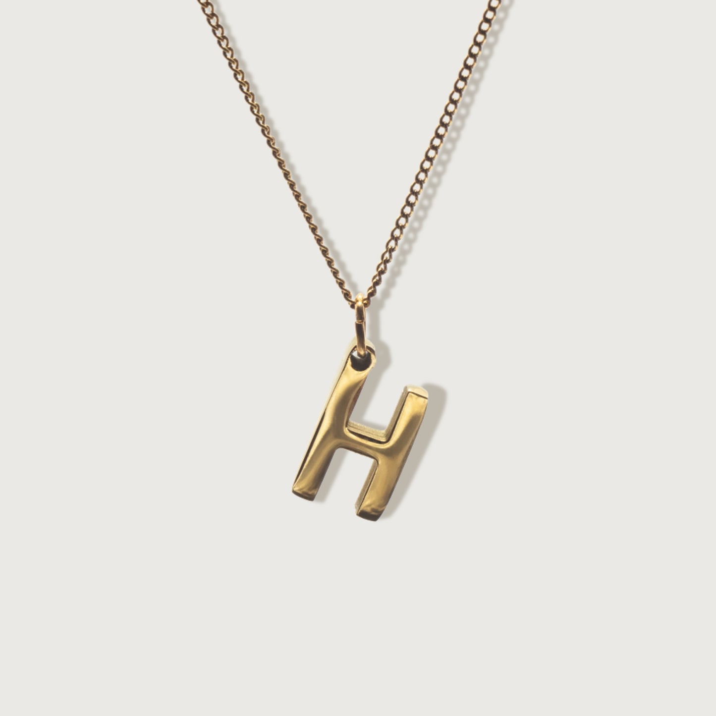 Up close Front view of the adjustable dainty cable necklace showcasing its elegant design and fine craftsmanship with charm initial pendant.