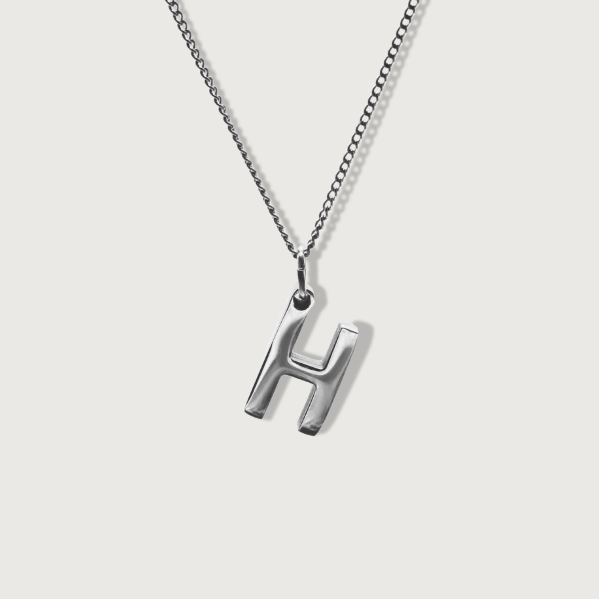 Front view of the silver adjustable dainty cable necklace showcasing its elegant design and fine craftsmanship with charm initial pendant.